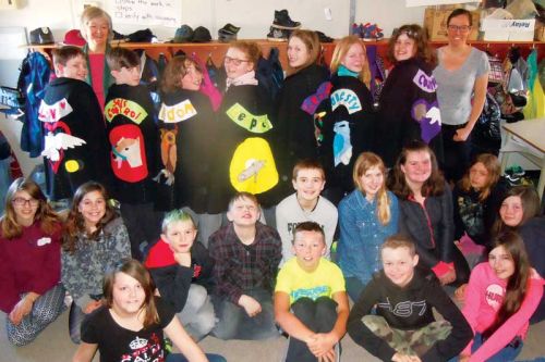 Miss Graham and textile artist Elinor Rush with grade six students at Perth Road PS and their “character capes”